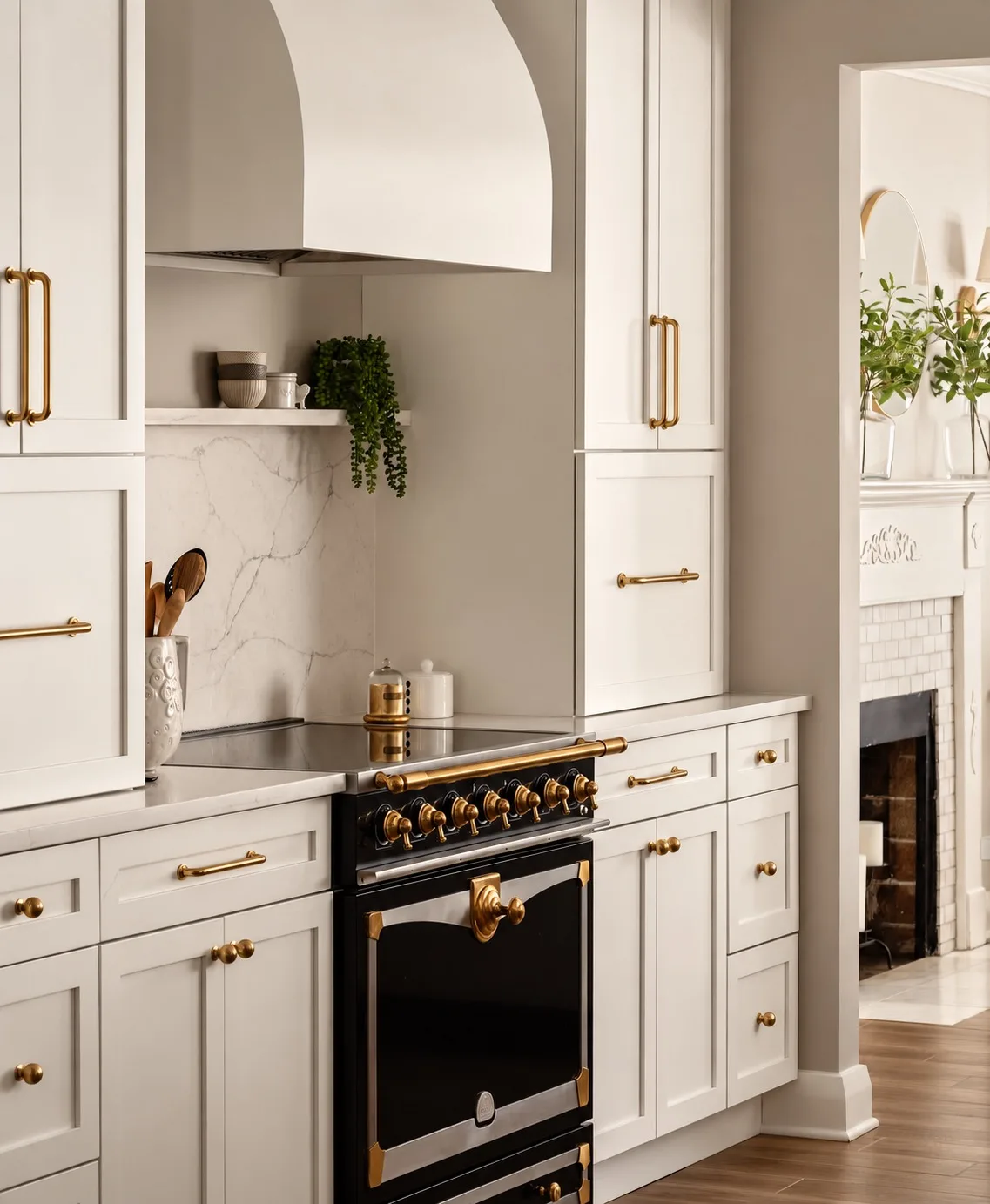 Kitchen remodel in Tampa, FL with white cabinets, black range, and brass hardware