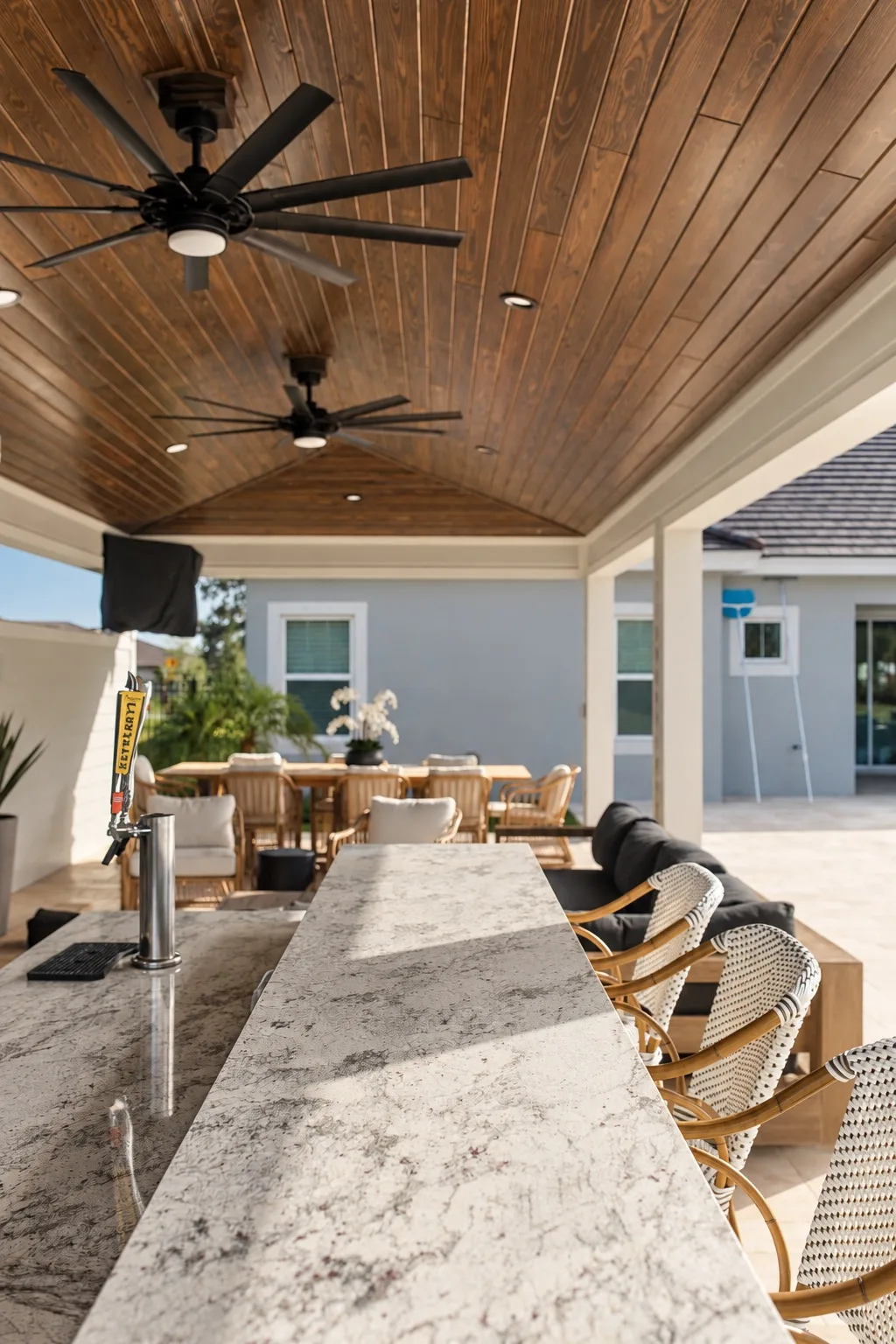 Outdoor bar top with granite counter under a covered patio in Tampa, FL
