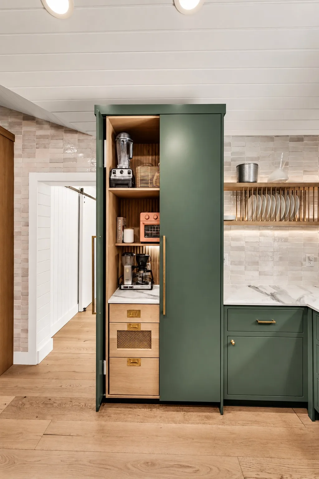 Kitchen remodel in Tampa, FL with hidden appliance garage and green custom cabinetry