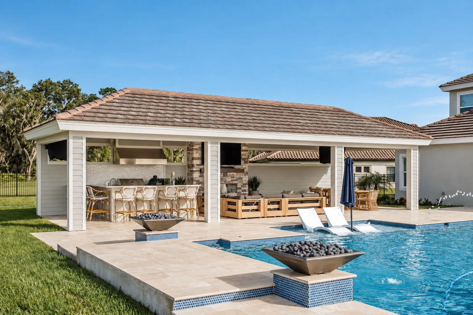 Backyard pavilion in Tampa, FL with pool, outdoor kitchen, and fire bowls