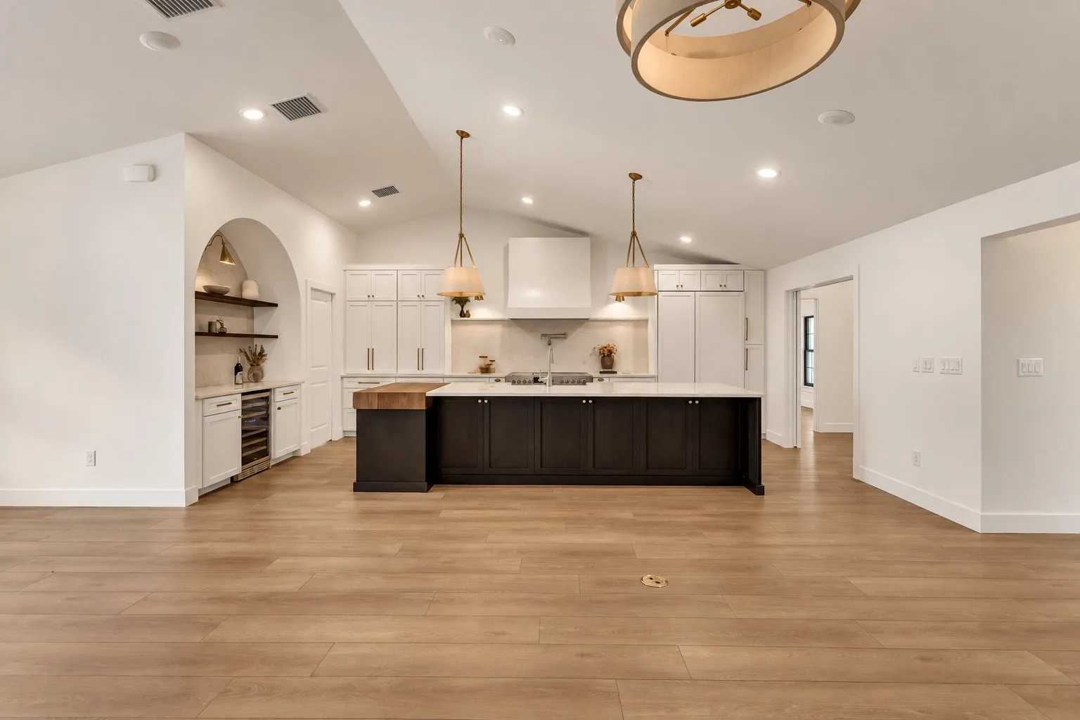 Spacious modern kitchen remodel in Tampa, FL with dark island