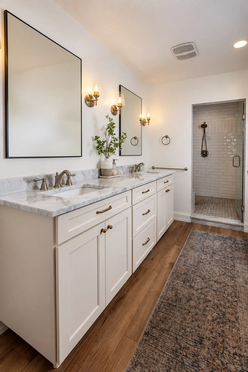 Bathroom remodel in Tampa, FL with white double-sink vanity and marble countertops