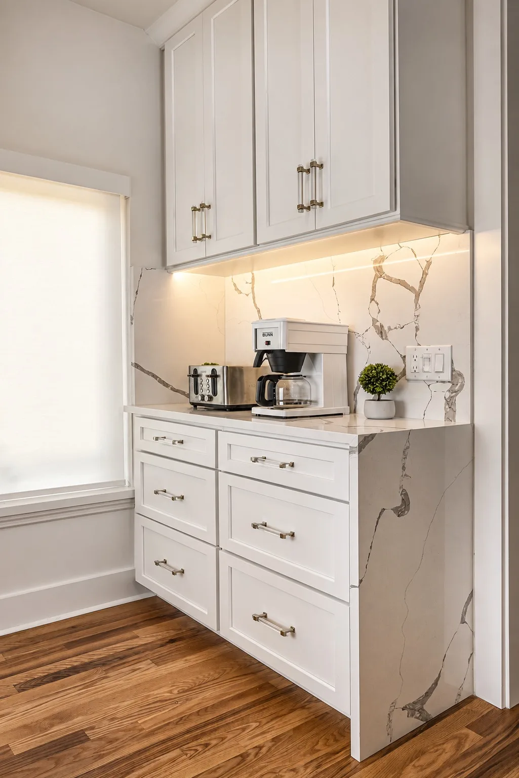 White coffee station in Tampa, FL with quartz backsplash