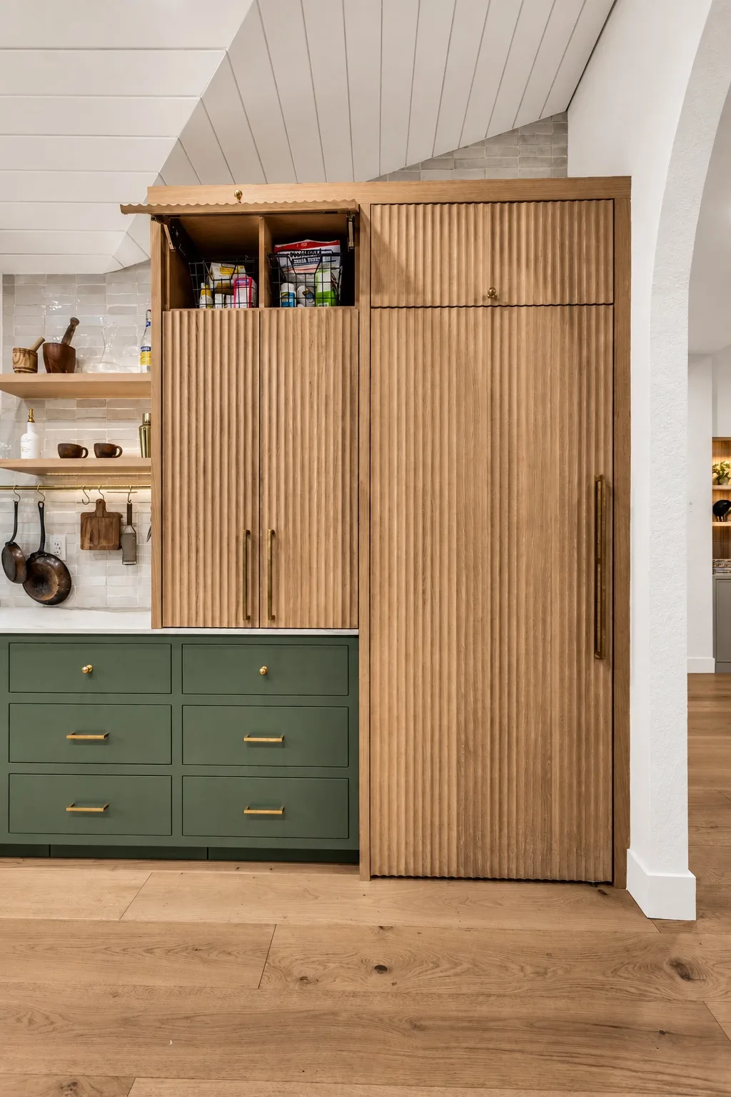 Custom pantry in Tampa, FL with green cabinetry and drawer storage