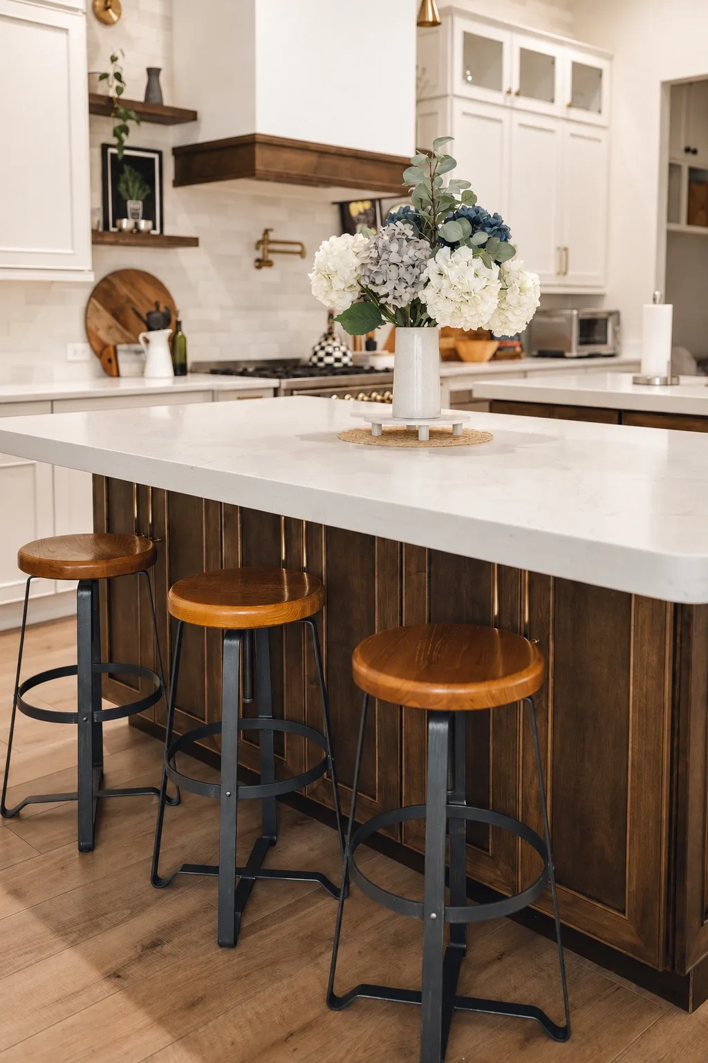 Kitchen remodel in Tampa, FL with white quartz island and wood stools