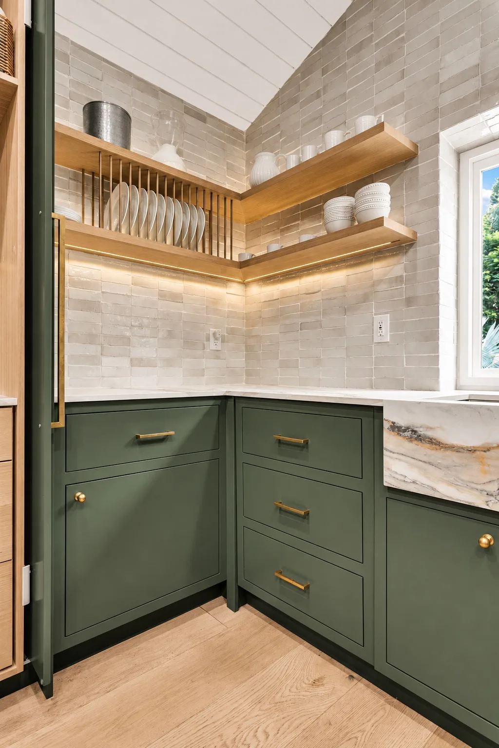 Butler's pantry in Tampa, FL with green cabinetry and open shelving