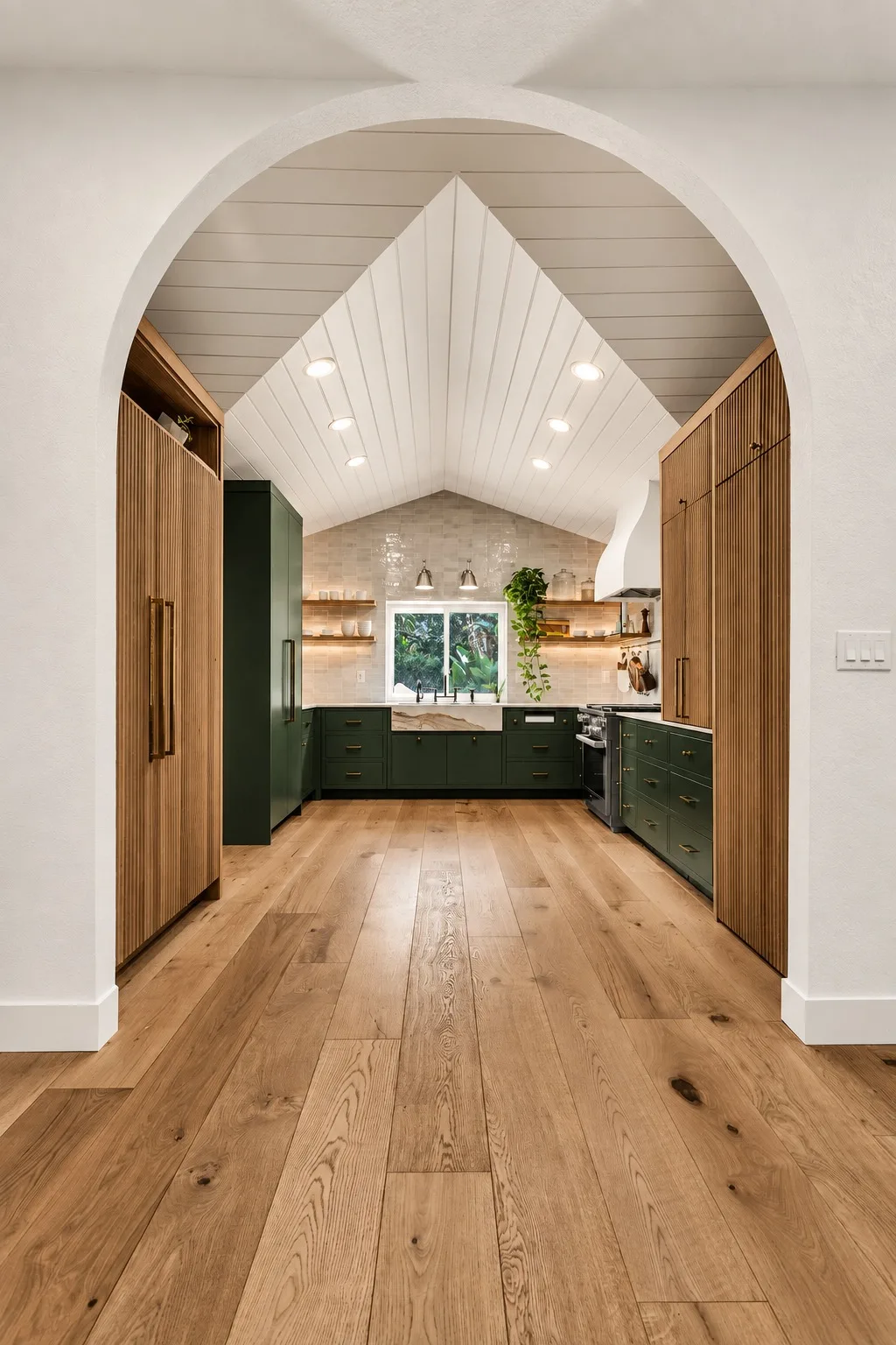 Kitchen remodel in Tampa, FL with vaulted ceiling and green cabinets