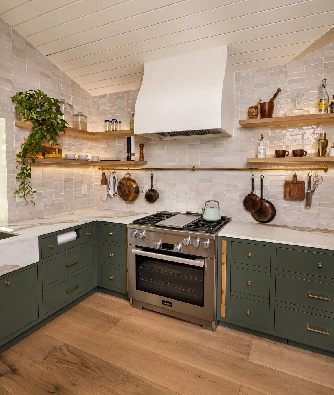 Kitchen remodel in Tampa, FL with green cabinets, open shelving, and custom range hood