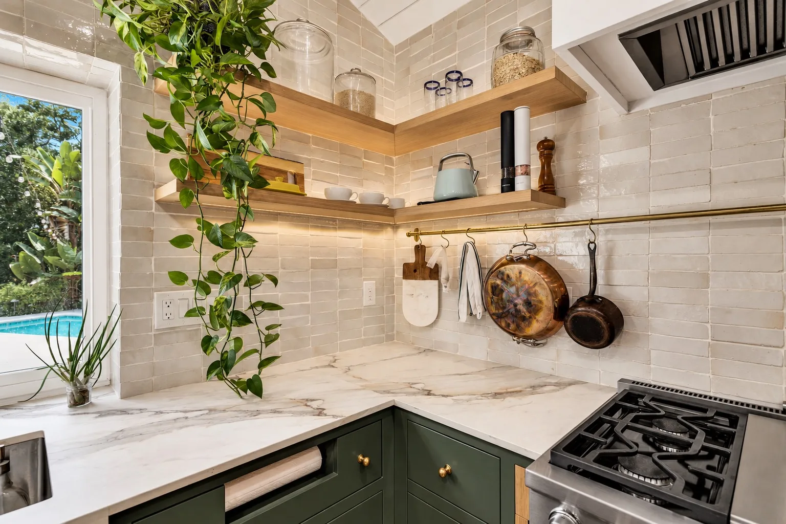 Kitchen remodel in Tampa, FL with corner open shelving and green cabinets