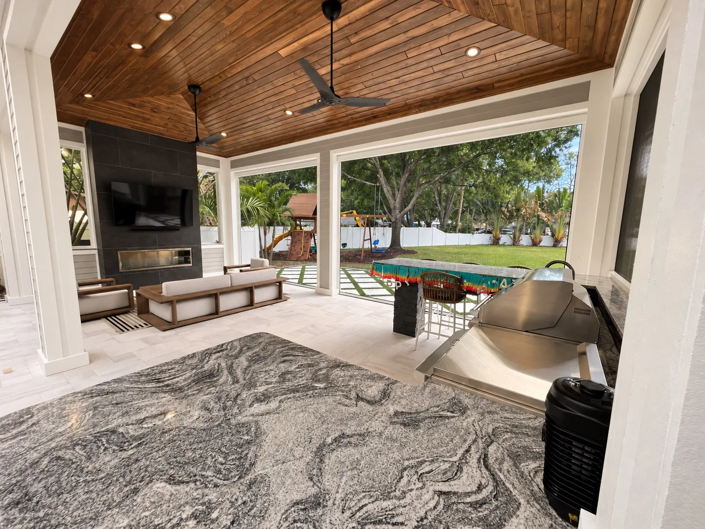 Modern outdoor kitchen in Tampa, FL under a covered patio