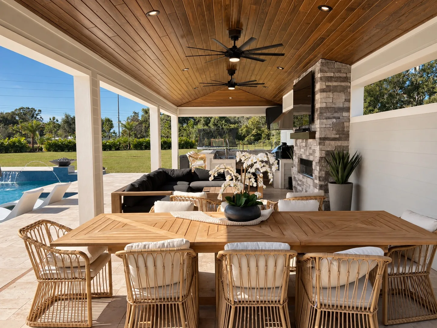 Outdoor living space in Tampa, FL with covered patio and poolside dining