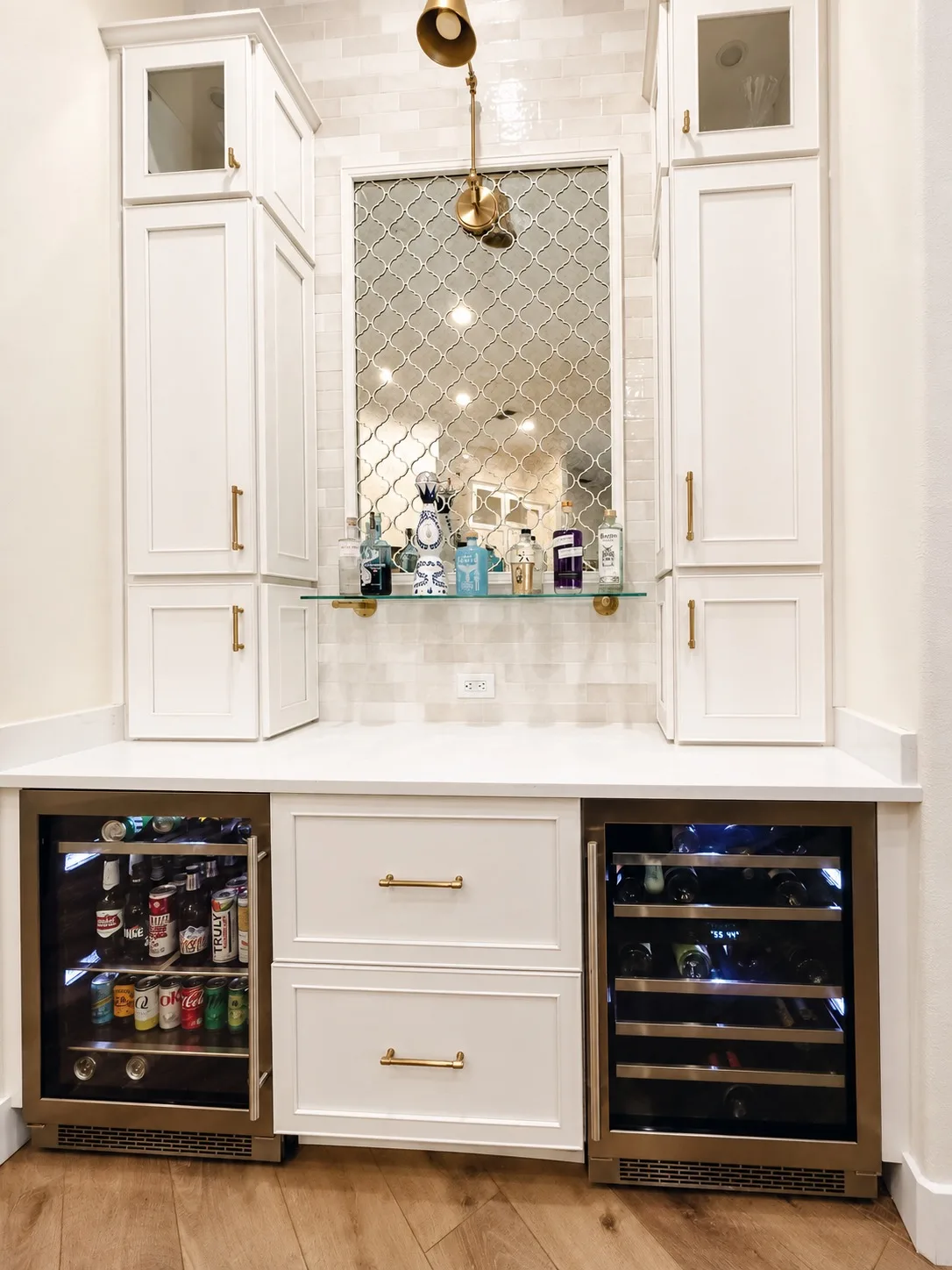 Modern home bar in Tampa, FL with wine fridge and beverage cooler