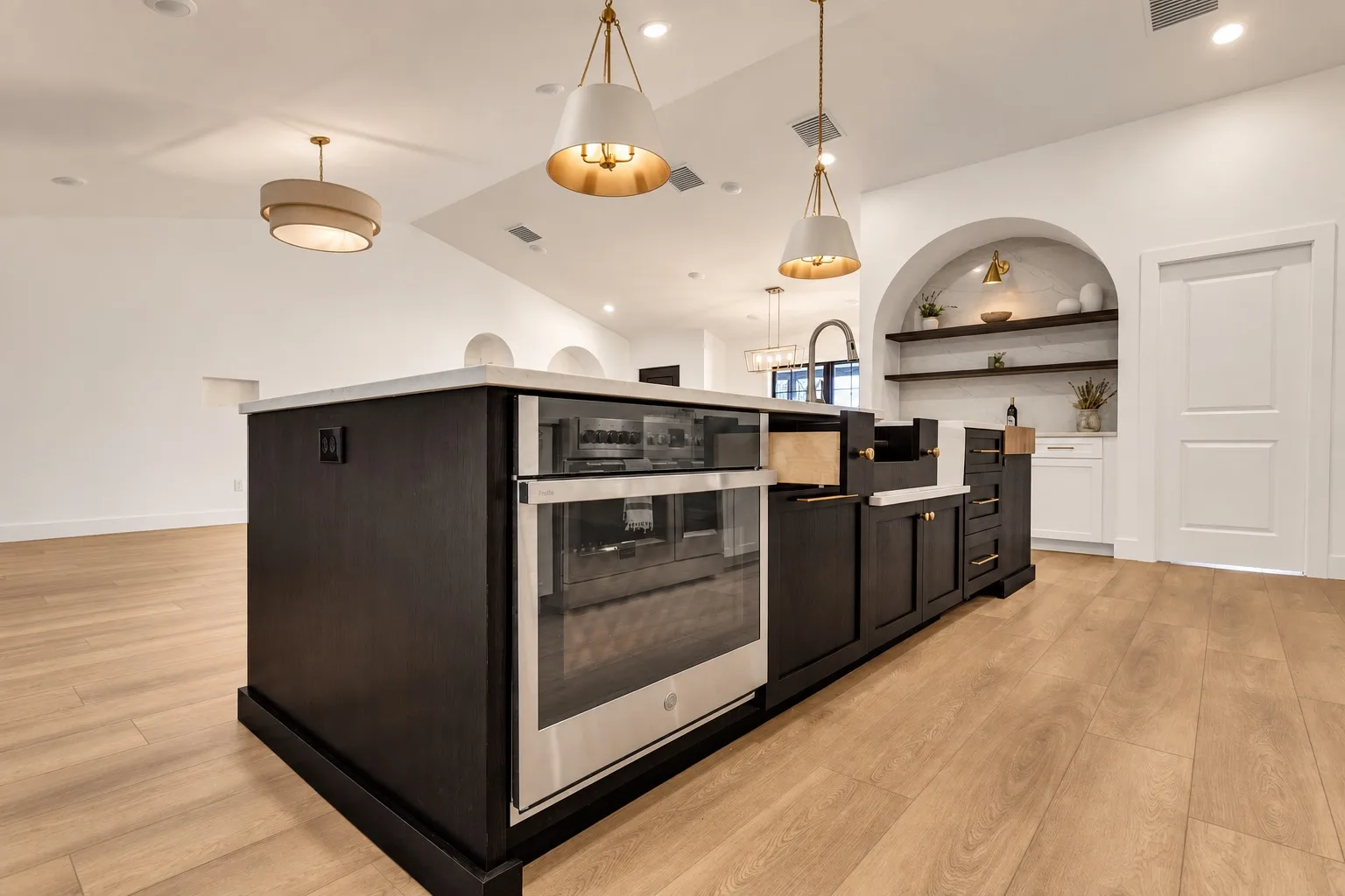 Modern kitchen remodel in Tampa, FL with black kitchen island